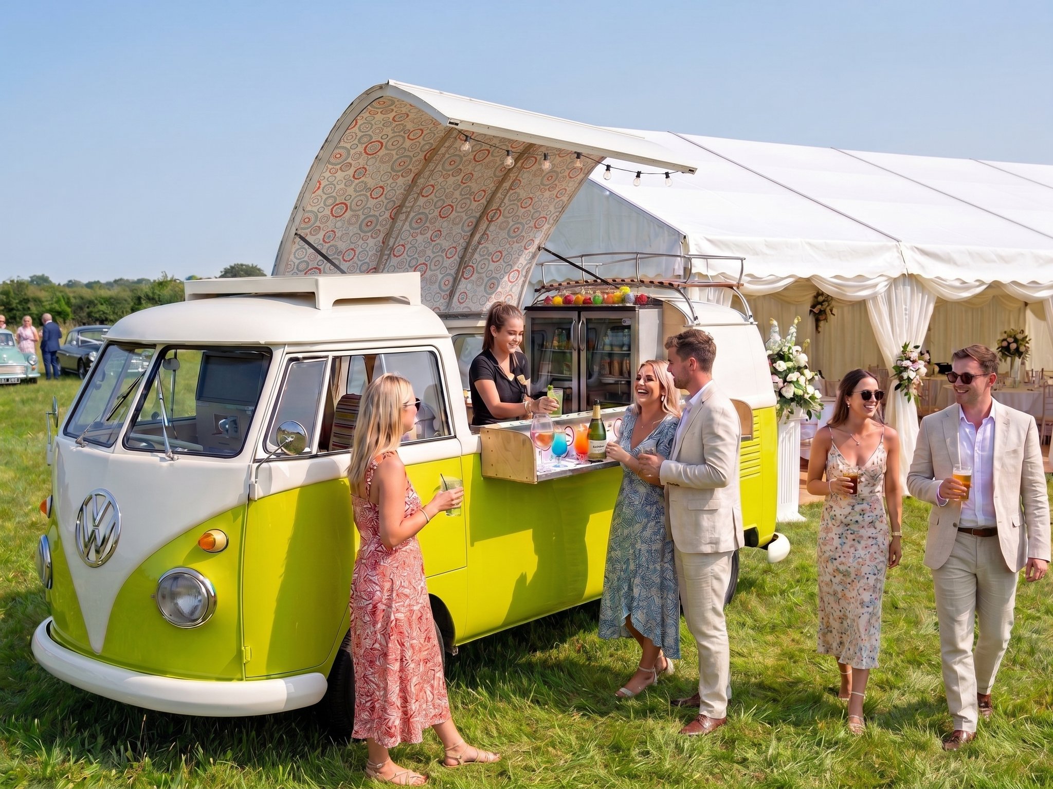 Harvey serving drinks to guests at an outdoor summer wedding